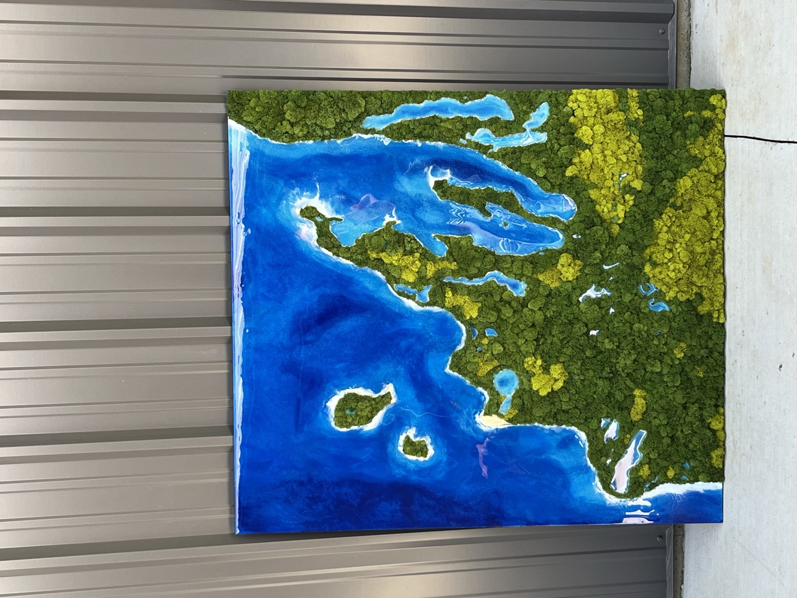 Large aerial lake artwork with island chain